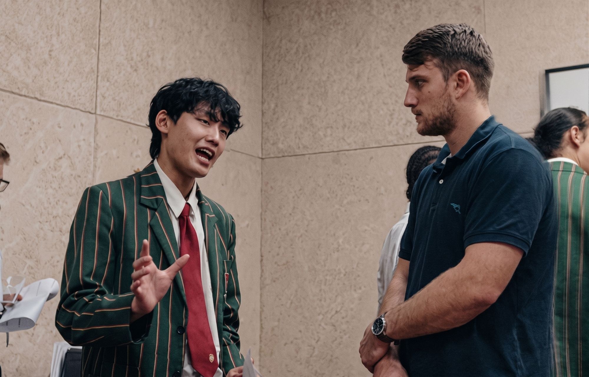 A student talking through his business one-on-one with his mentor