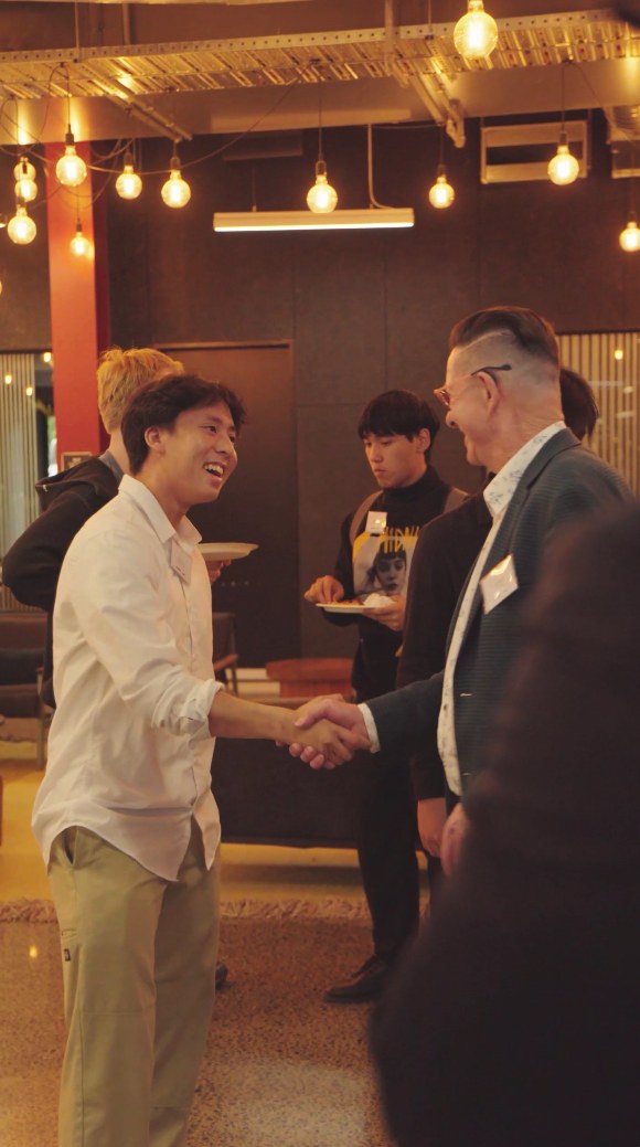 Students and guests meeting after Showcase Night